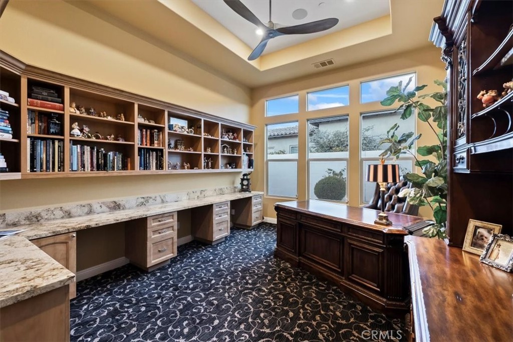 81094 Monarchos Circle La Quinta, CA 92253 - Photo 58 of 75 a room with furniture a rug and a window