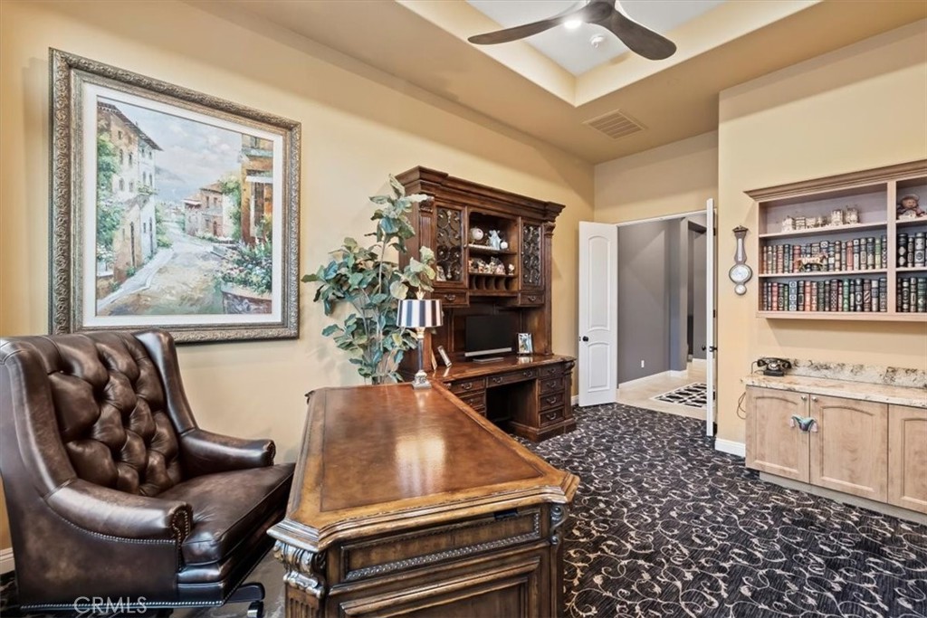 81094 Monarchos Circle La Quinta, CA 92253 - Photo 59 of 75 a living room with furniture and a flat screen tv