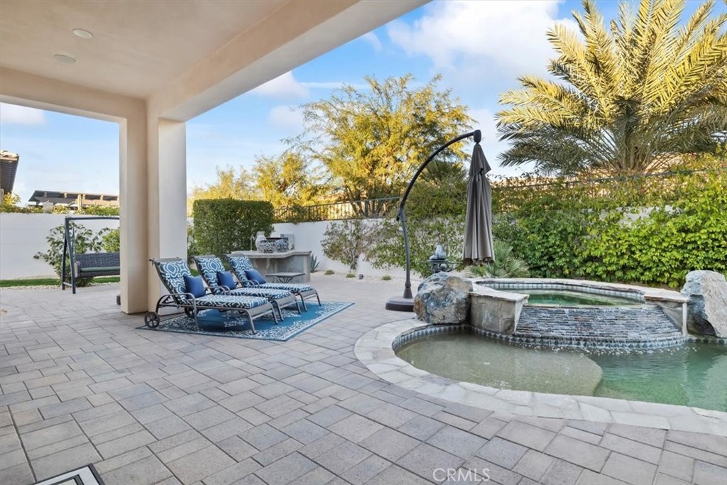81094 Monarchos Circle La Quinta, CA 92253 - Photo 68 of 75 a view of a swimming pool with lounge chair