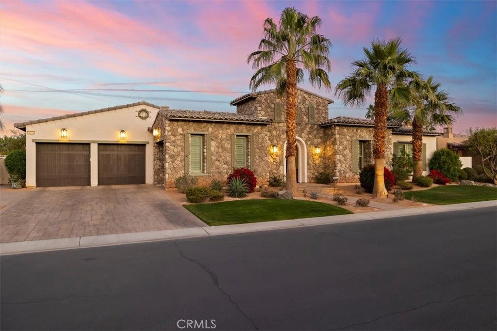 81094 Monarchos Circle La Quinta, CA 92253 - Photo 70 of 75 a front view of a house with a yard and garage