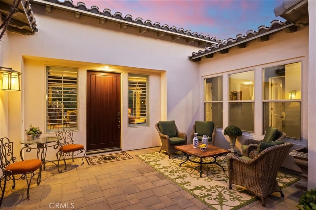 81094 Monarchos Circle La Quinta, CA 92253 - Photo 71 of 75 a patio with patio couch and a dining table