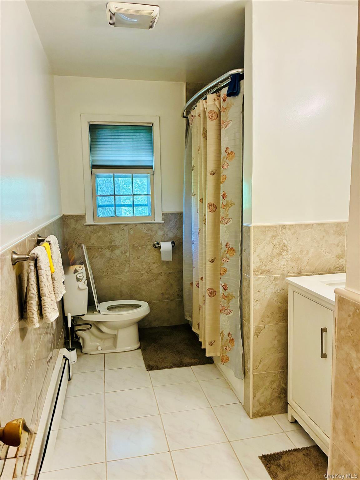 24 Ann Boulevard Spring Valley, NY 10977 - Photo 11 of 25 a bathroom with a granite countertop shower and a sink