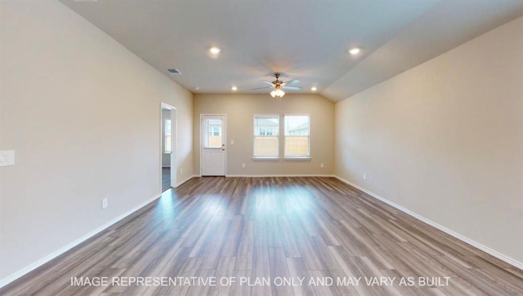 10312 Neptune Court Waco, TX 76708 - Photo 4 of 9 wooden floor in an empty room with a window