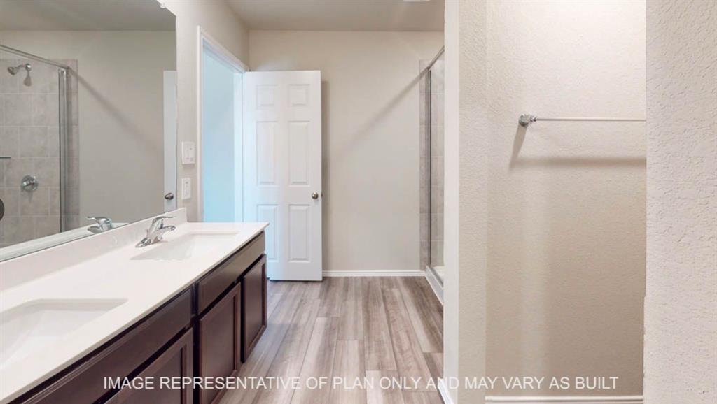 10312 Neptune Court Waco, TX 76708 - Photo 6 of 9 a bathroom with a sink and a mirror