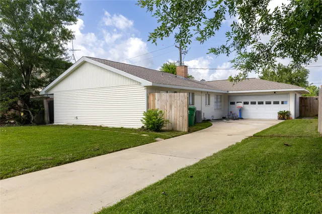 a house view with a garden space