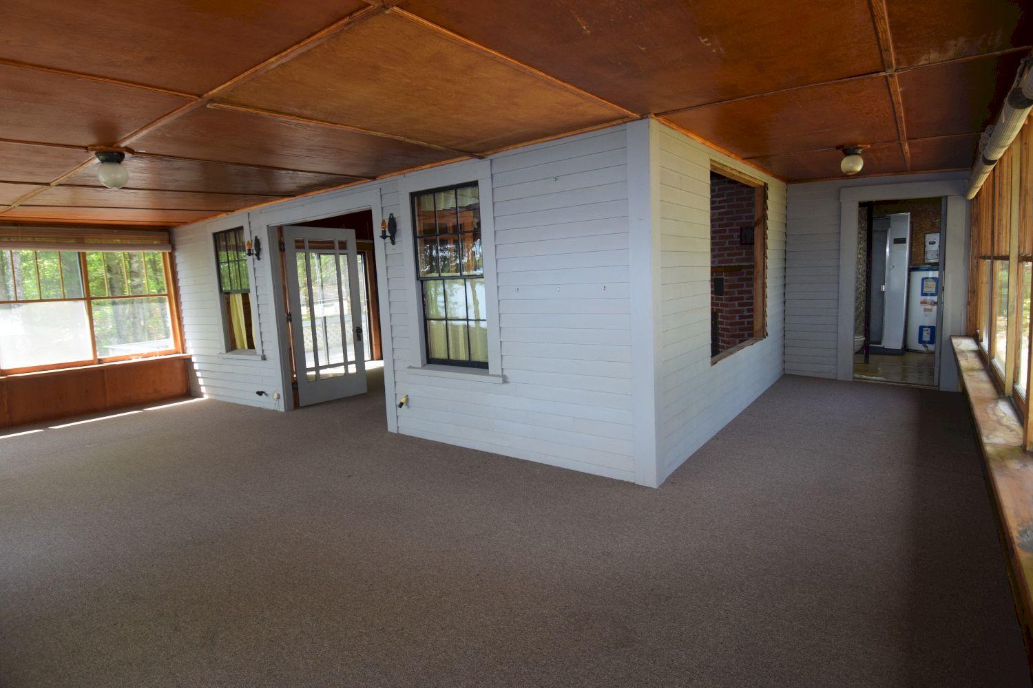11-12 Rocky Point Road Embden, ME 04958 - Photo 23 of 75 camp 1 - living room with wrap around po