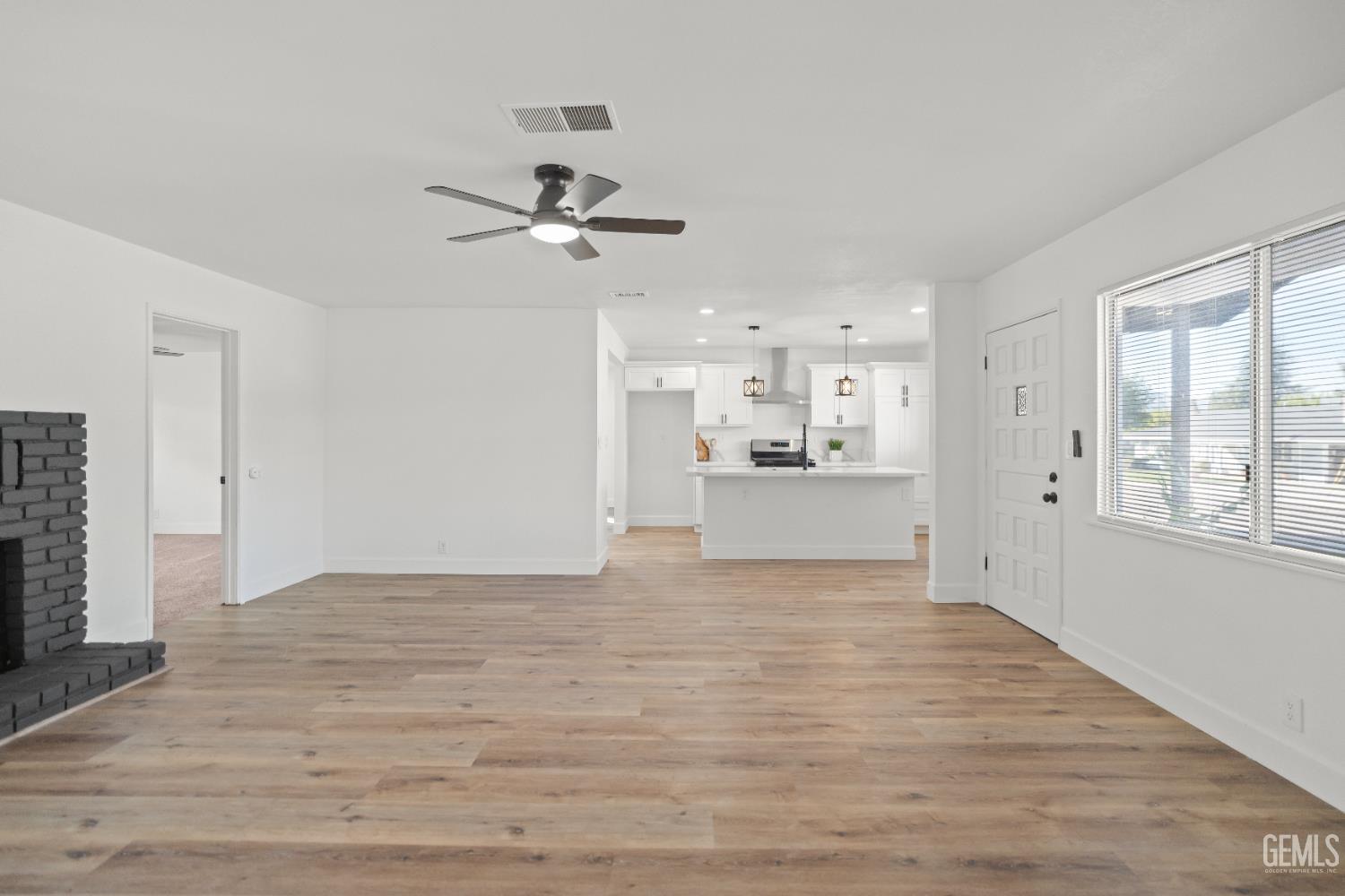 Undisclosed Address Tehachapi, CA 93561 - Photo 11 of 49 a view of a kitchen with wooden floor and a kitchen
