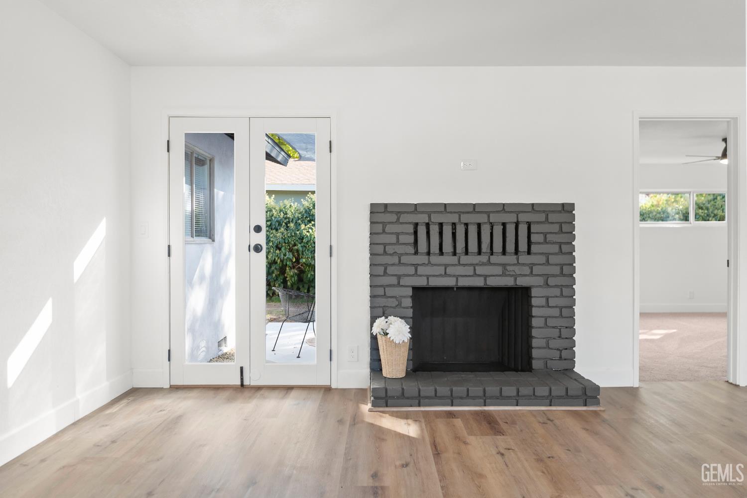 Undisclosed Address Tehachapi, CA 93561 - Photo 12 of 49 a living room with a fireplace and a rug