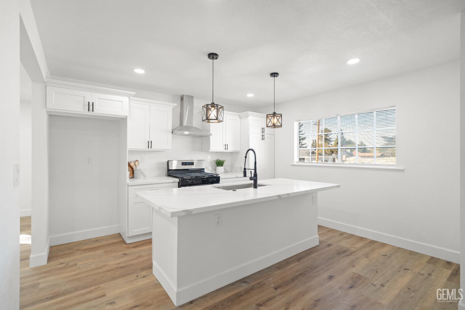 Undisclosed Address Tehachapi, CA 93561 - Photo 15 of 49 a kitchen with stainless steel appliances a sink a stove a refrigerator cabinets and wooden floor