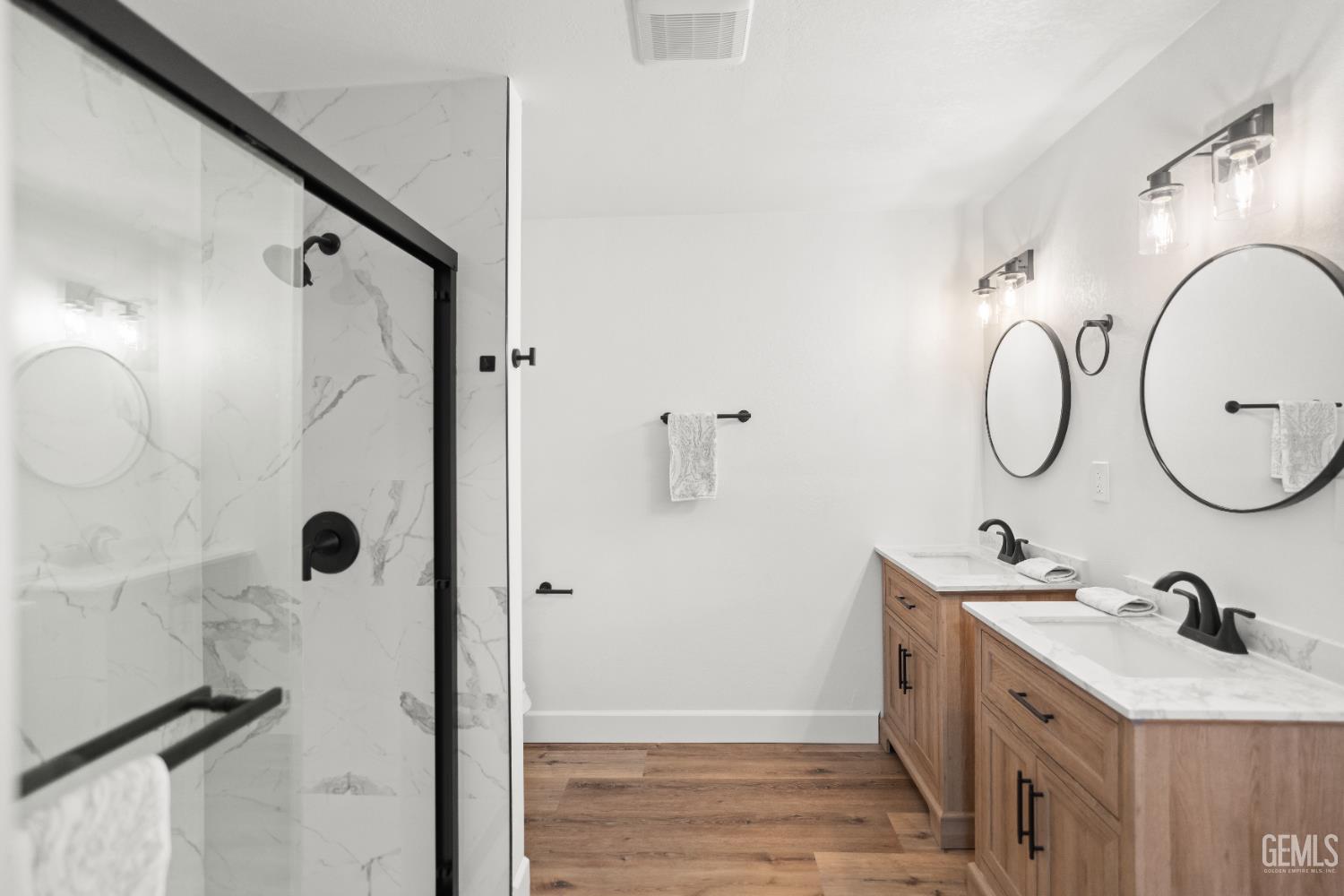 Undisclosed Address Tehachapi, CA 93561 - Photo 30 of 49 a bathroom with a double vanity sink mirror and shower