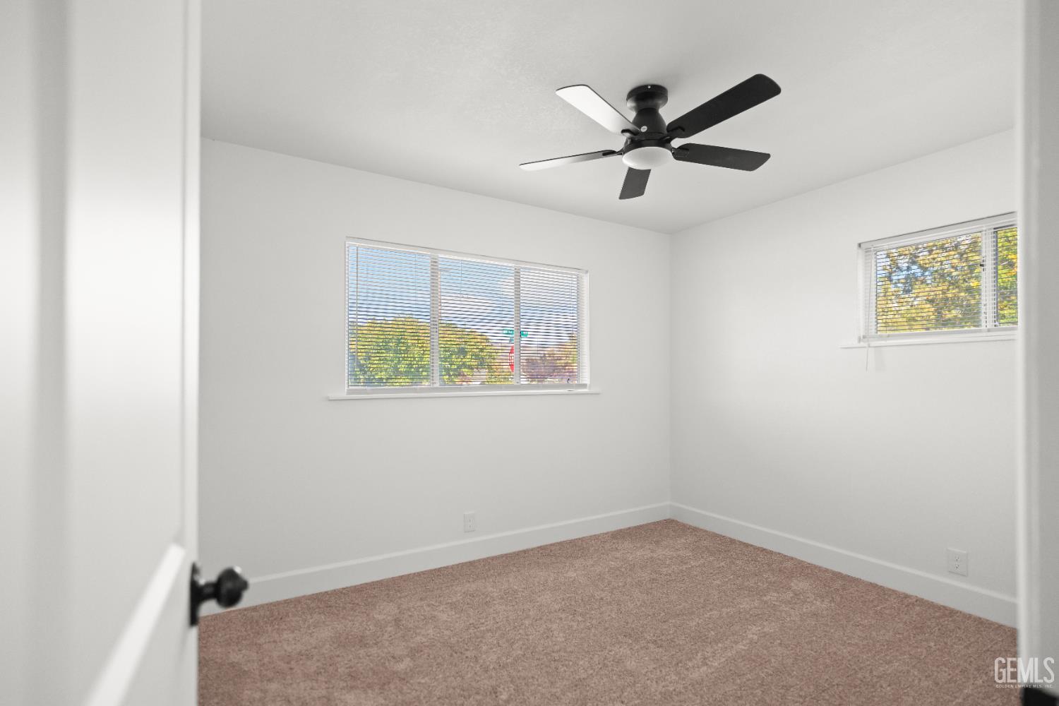 Undisclosed Address Tehachapi, CA 93561 - Photo 34 of 49 an empty room with ceiling fan and window