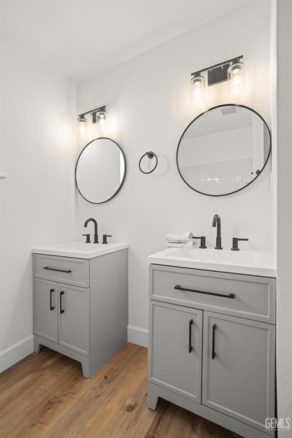 Undisclosed Address Tehachapi, CA 93561 - Photo 36 of 49 a bathroom with a double vanity sink and a mirror