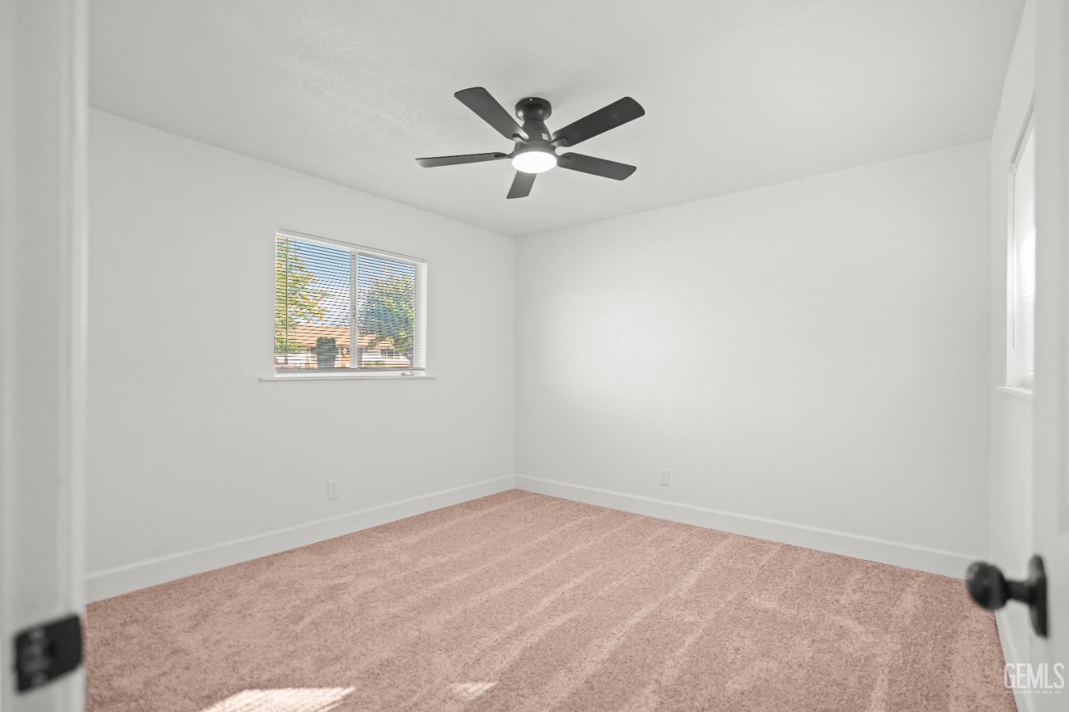 Undisclosed Address Tehachapi, CA 93561 - Photo 37 of 49 an empty room with a window and a ceiling fan