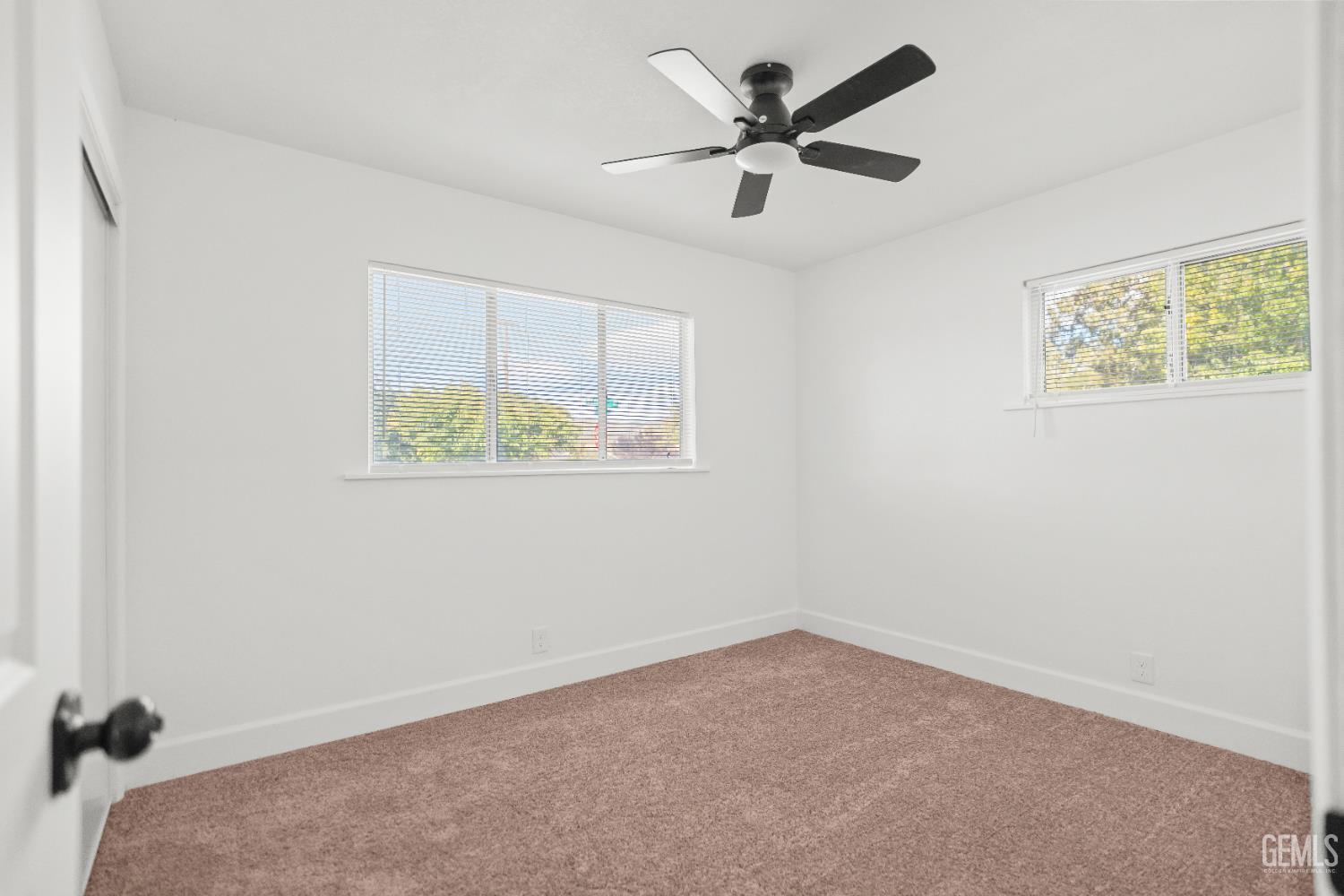 Undisclosed Address Tehachapi, CA 93561 - Photo 38 of 49 an empty room with a window and a ceiling fan