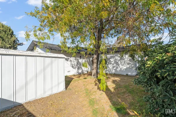 a view of a backyard of a house