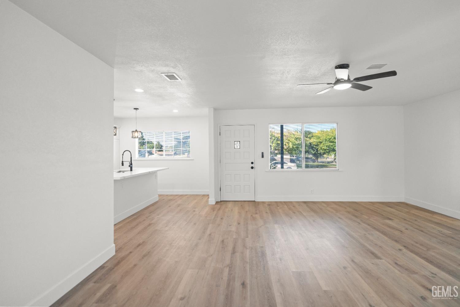 Undisclosed Address Tehachapi, CA 93561 - Photo 10 of 49 wooden floor in an empty room with a window