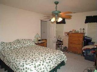 184 Calistoga Road Santa Rosa, CA 95409 - Photo 9 of 11 a bedroom with a bed and ceiling fan
