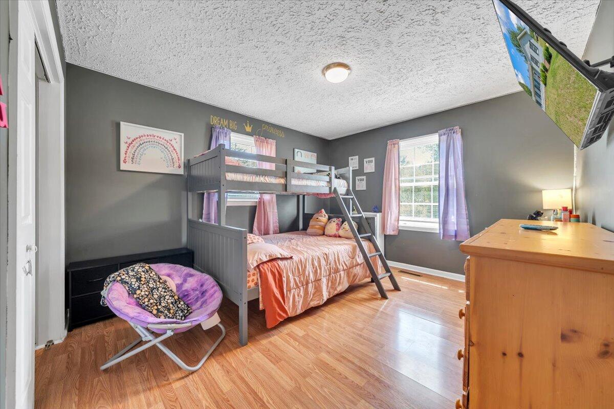 3870 Goose Dam Road Rocky Mount, VA 24151 - Photo 25 of 44 a bedroom with a bed and wooden floor