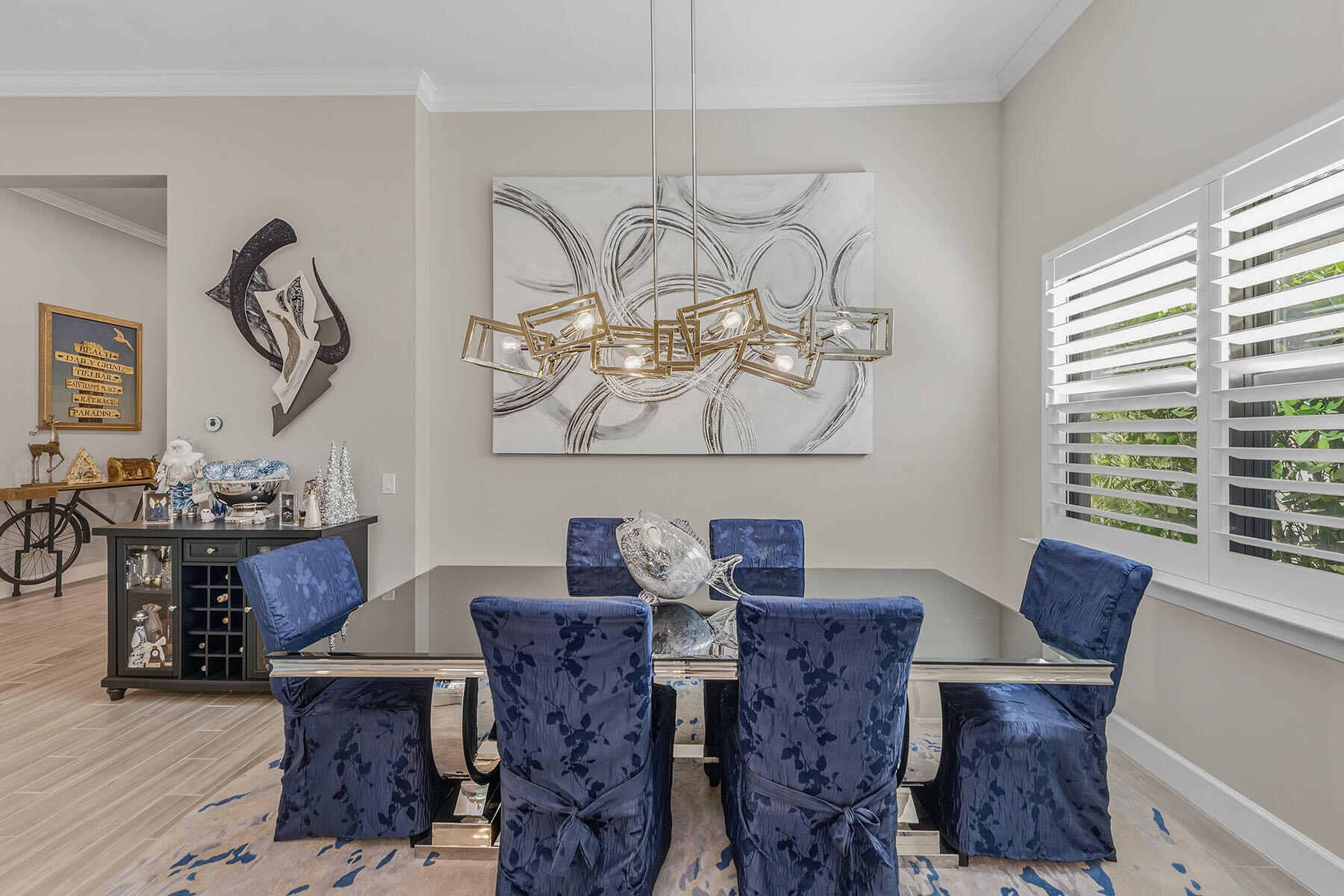2797 Amaranda Court Naples, FL 34114 - Photo 14 of 50 a view of a dining room with furniture window and wooden floor