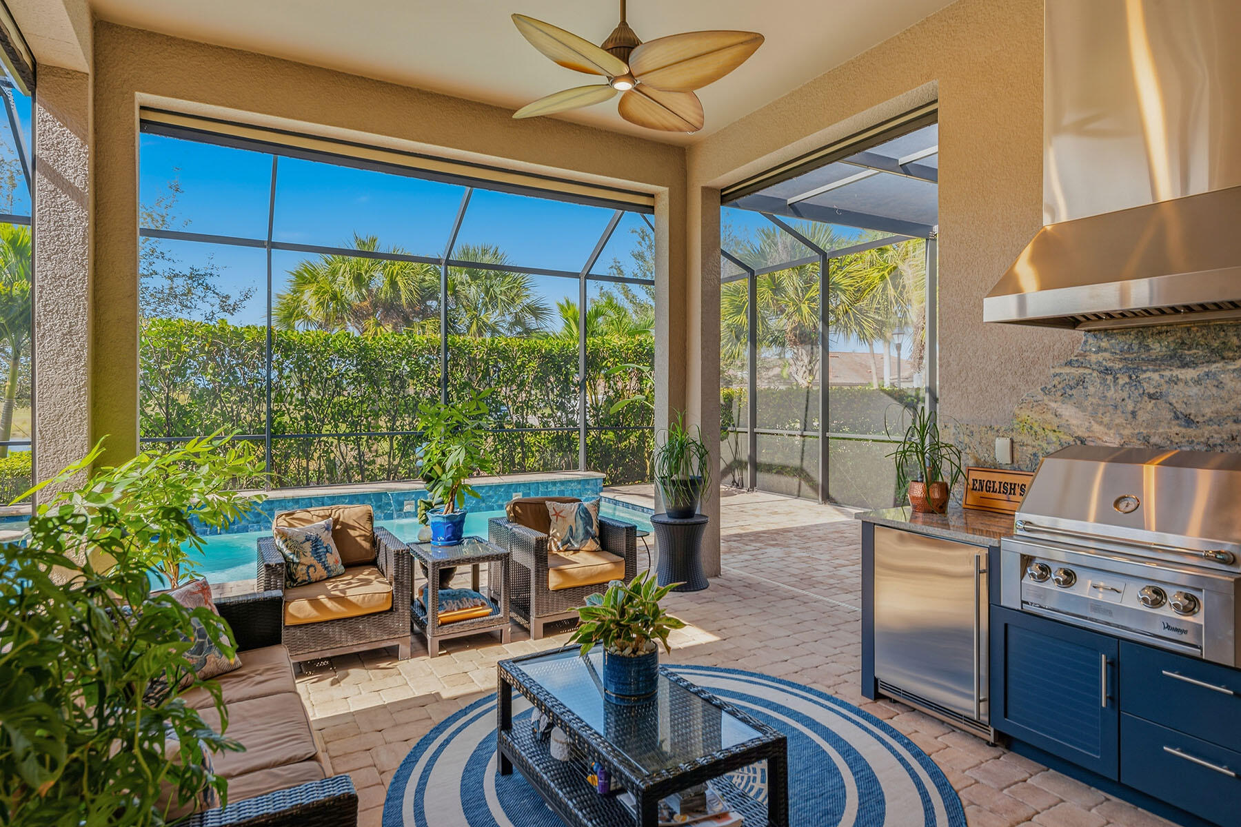 2797 Amaranda Court Naples, FL 34114 - Photo 3 of 50 a kitchen with stainless steel appliances granite countertop a stove a refrigerator a dining table and chairs with the couches