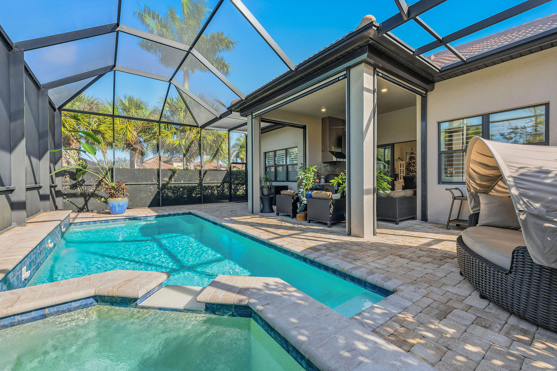 2797 Amaranda Court Naples, FL 34114 - Photo 31 of 50 a patio with a yard table and chairs