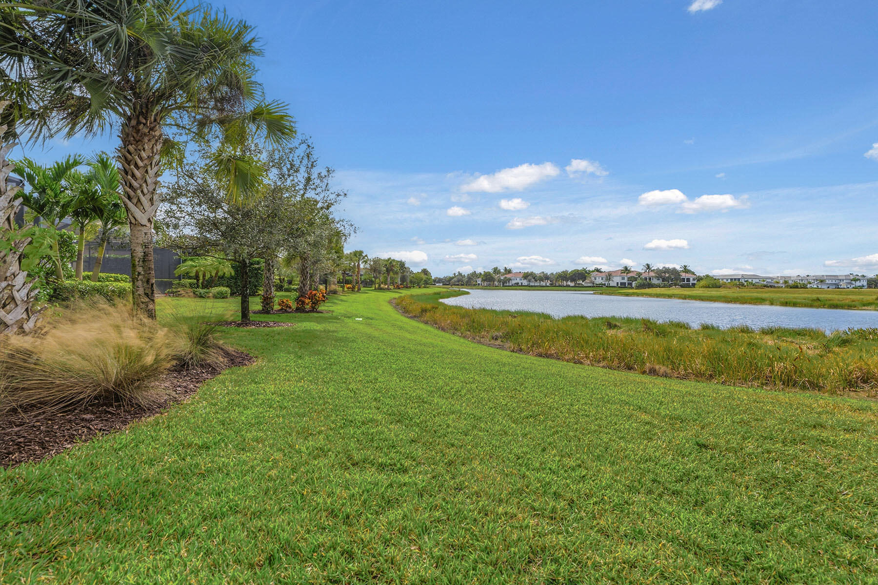 2797 Amaranda Court Naples, FL 34114 - Photo 34 of 50 a view of a lake with houses in the back