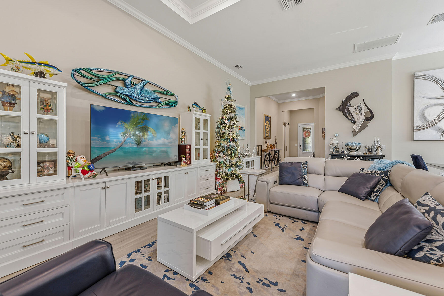 2797 Amaranda Court Naples, FL 34114 - Photo 5 of 50 a living room with furniture a flat screen tv and kitchen view