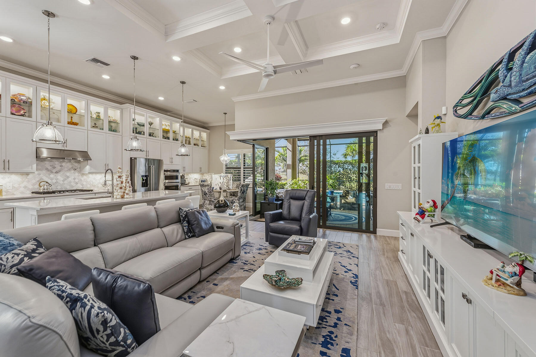 2797 Amaranda Court Naples, FL 34114 - Photo 7 of 50 a living room with furniture ceiling fan and a rug