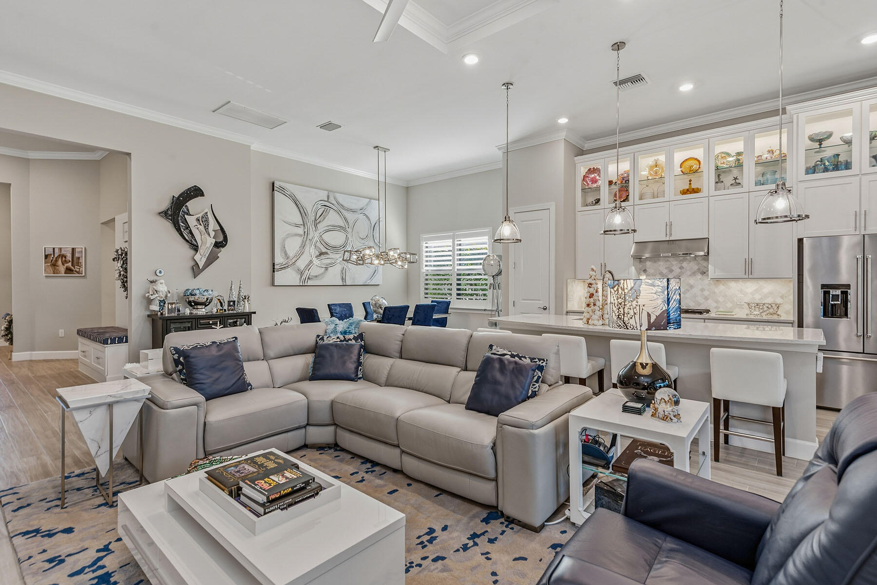2797 Amaranda Court Naples, FL 34114 - Photo 8 of 50 a living room with furniture a rug and white walls
