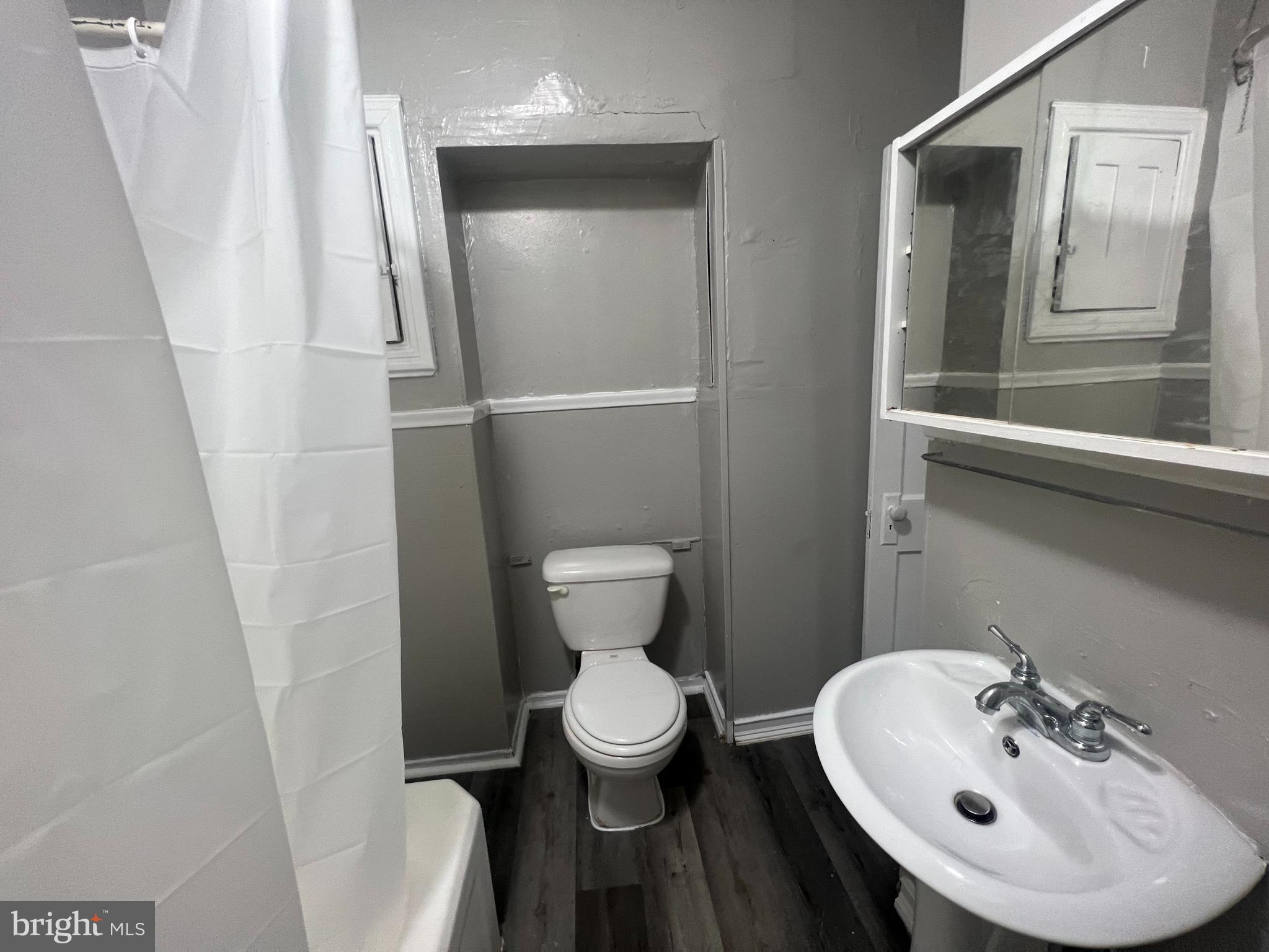 4637 Leiper Street, Unit 4 Philadelphia, PA 19124 - Photo 4 of 5 a bathroom with a sink and a mirror