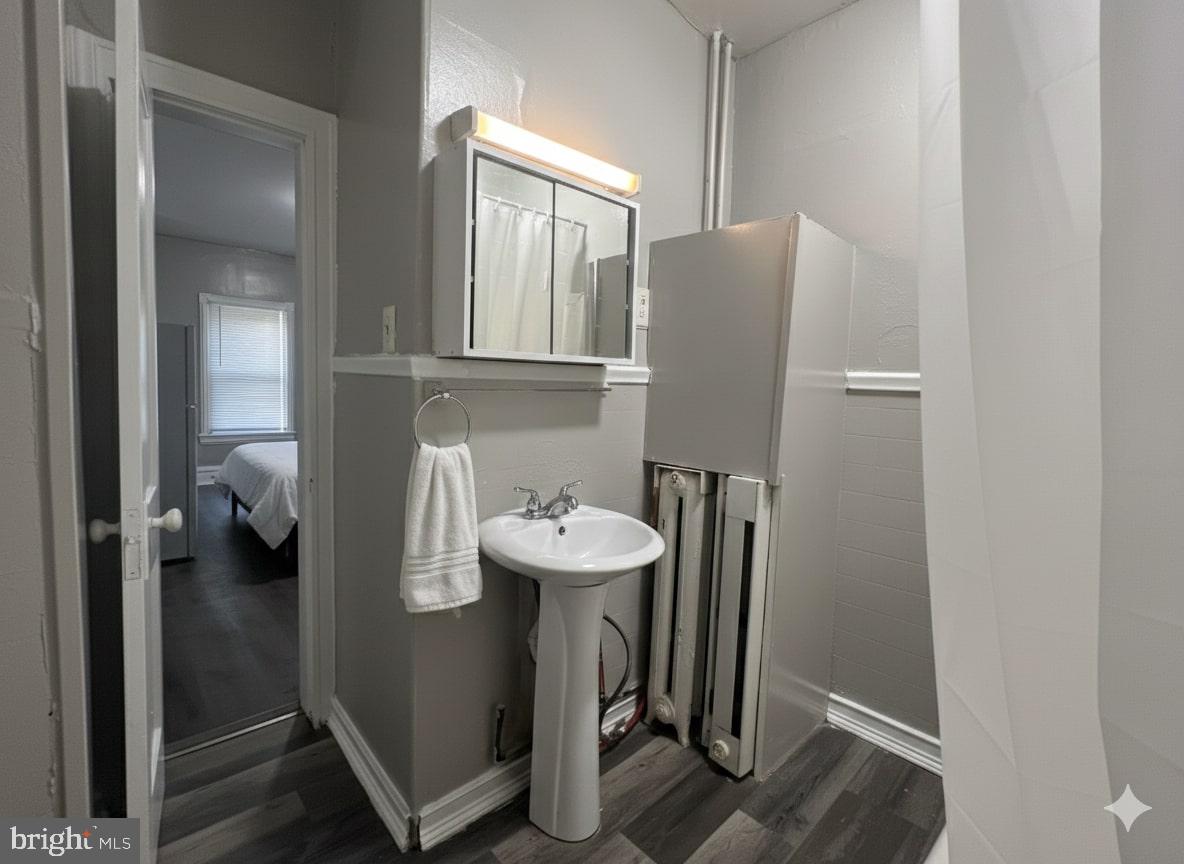 4637 Leiper Street, Unit 4 Philadelphia, PA 19124 - Photo 5 of 5 a bathroom with a sink and a mirror