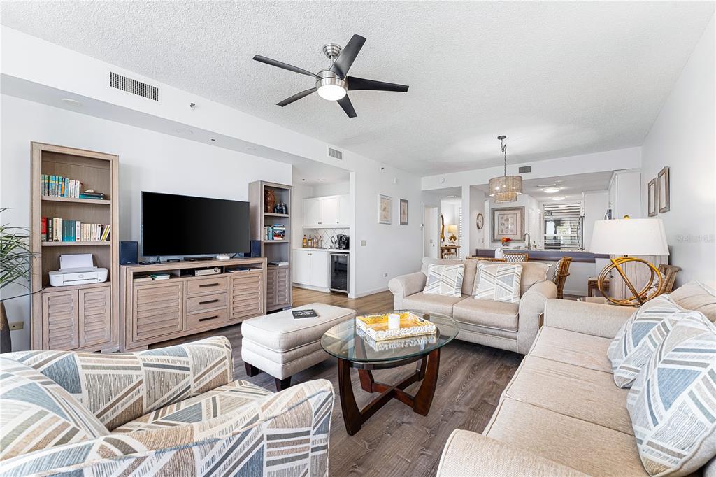 615 Dream Island Road, Unit 202 Longboat Key, FL 34228 - Photo 14 of 66 a living room with furniture and a flat screen tv
