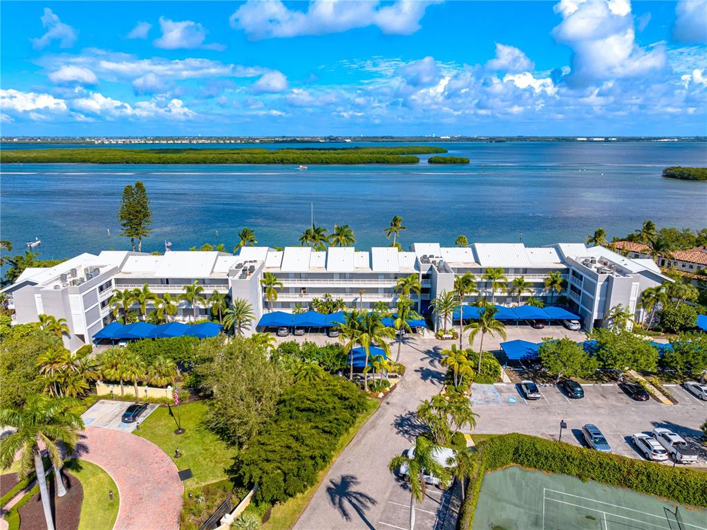 615 Dream Island Road, Unit 202 Longboat Key, FL 34228 - Photo 2 of 66 a view of swimming pool with outdoor seating