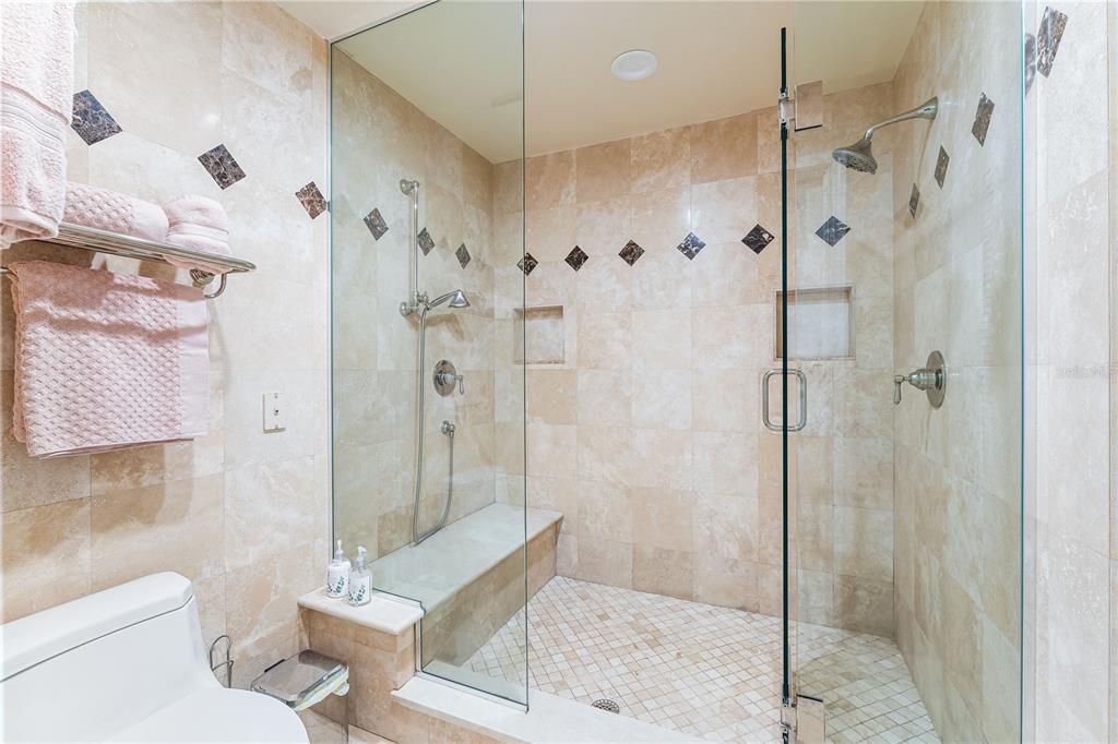 615 Dream Island Road, Unit 202 Longboat Key, FL 34228 - Photo 26 of 66 a bathroom with a shower and a toilet