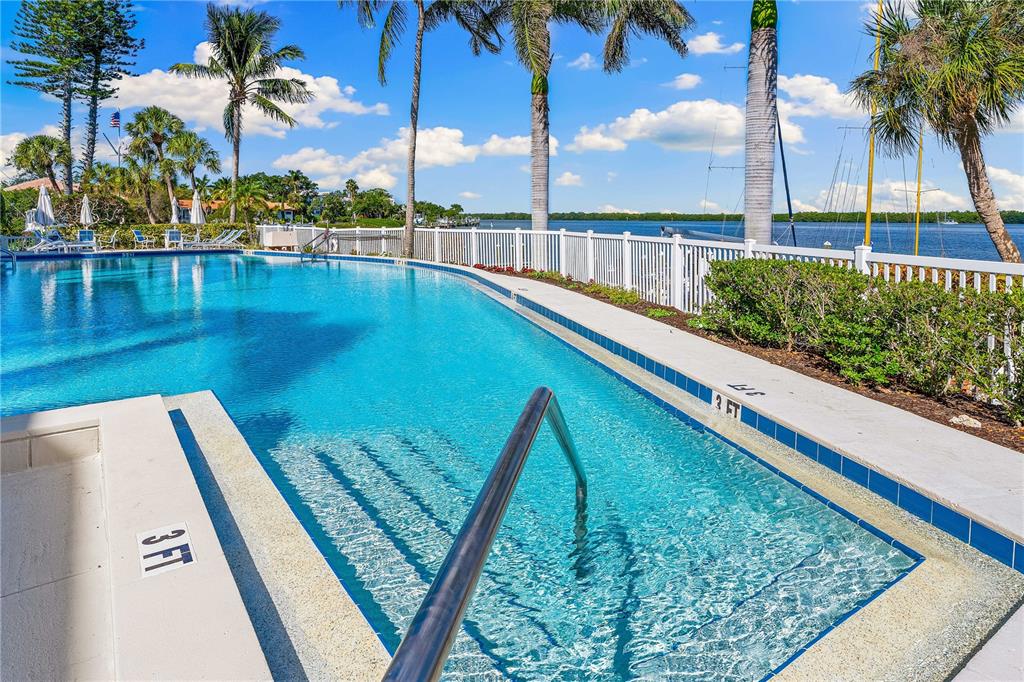 615 Dream Island Road, Unit 202 Longboat Key, FL 34228 - Photo 40 of 66 a view of swimming pool with a lounge chairs