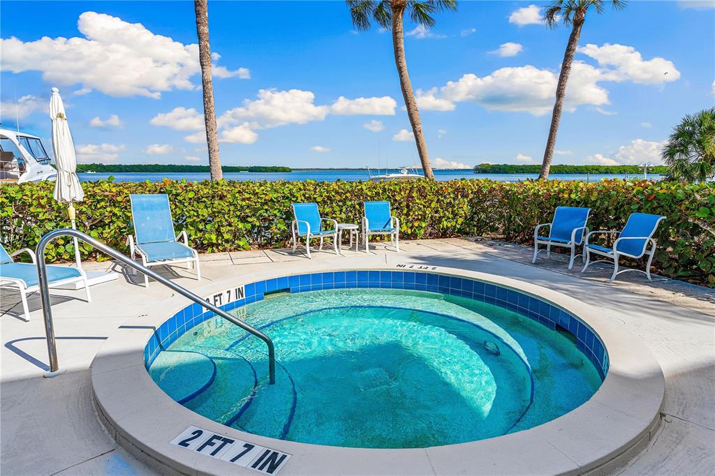615 Dream Island Road, Unit 202 Longboat Key, FL 34228 - Photo 43 of 66 a view of swimming pool having outdoor seating