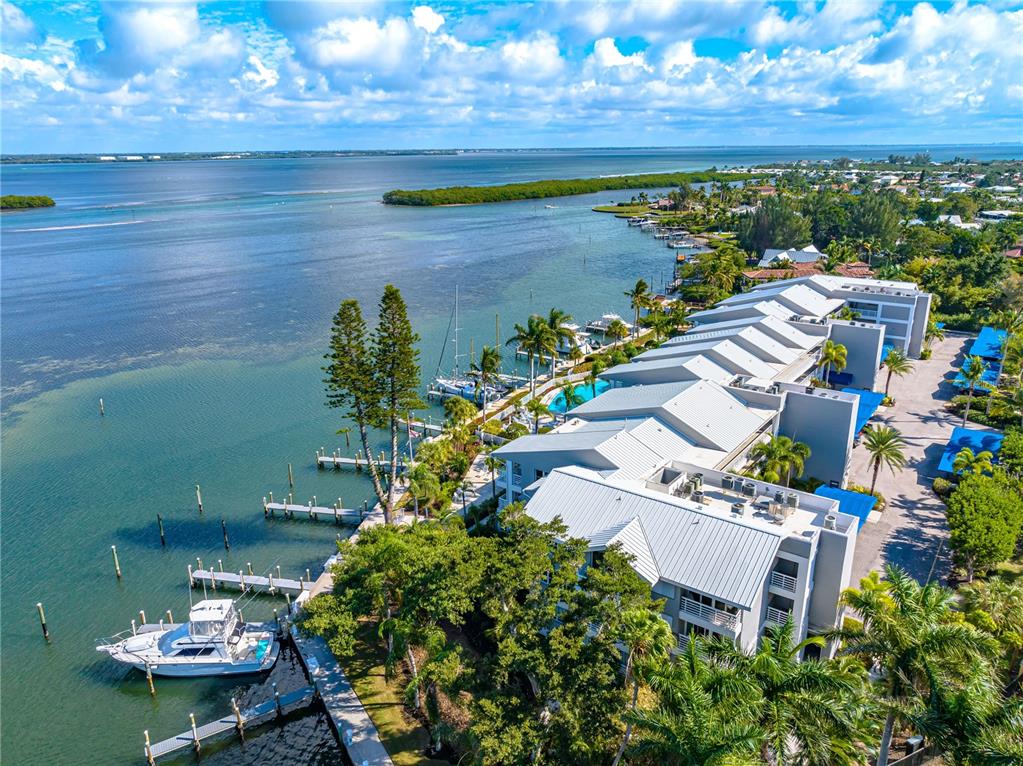 615 Dream Island Road, Unit 202 Longboat Key, FL 34228 - Photo 51 of 66 a view of a swimming pool with a patio