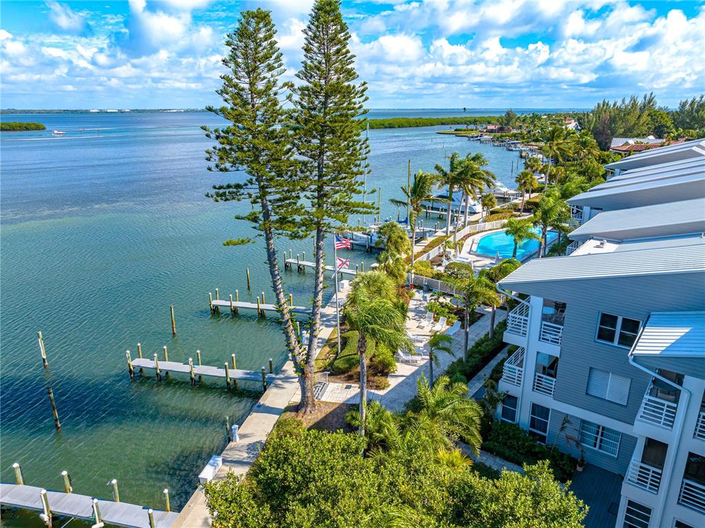 615 Dream Island Road, Unit 202 Longboat Key, FL 34228 - Photo 52 of 66 a view of a lake with a house