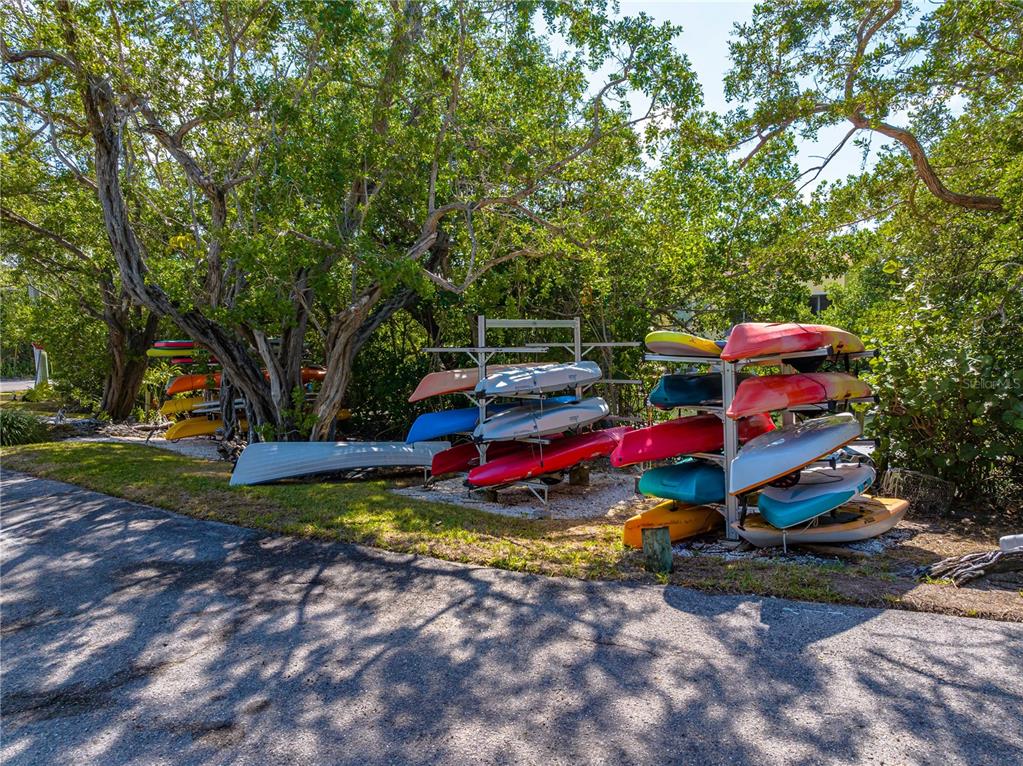 615 Dream Island Road, Unit 202 Longboat Key, FL 34228 - Photo 64 of 66 a view of yard with swimming pool and trees in the background