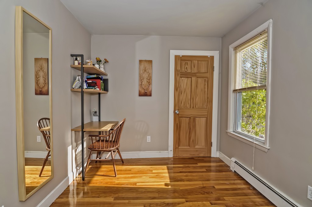 54 Main Street, Unit A Foxboro, MA 02035 - Photo 12 of 21 a view of a livingroom with furniture and a window