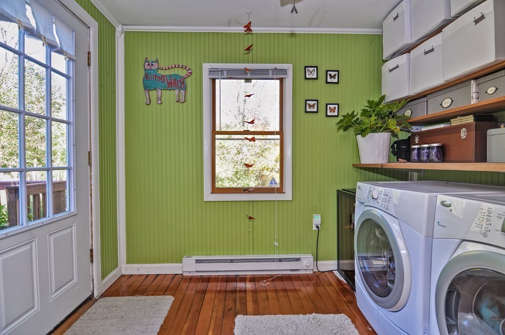 54 Main Street, Unit A Foxboro, MA 02035 - Photo 15 of 21 a room with painting and a table