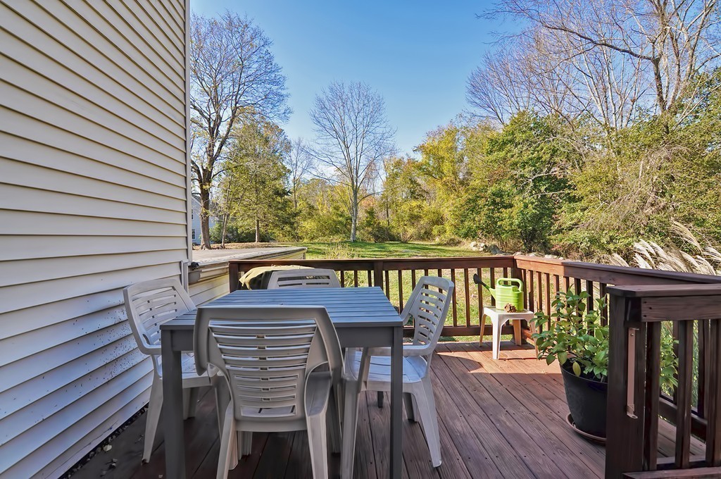 54 Main Street, Unit A Foxboro, MA 02035 - Photo 17 of 21 a view of balcony with furniture and wooden floor