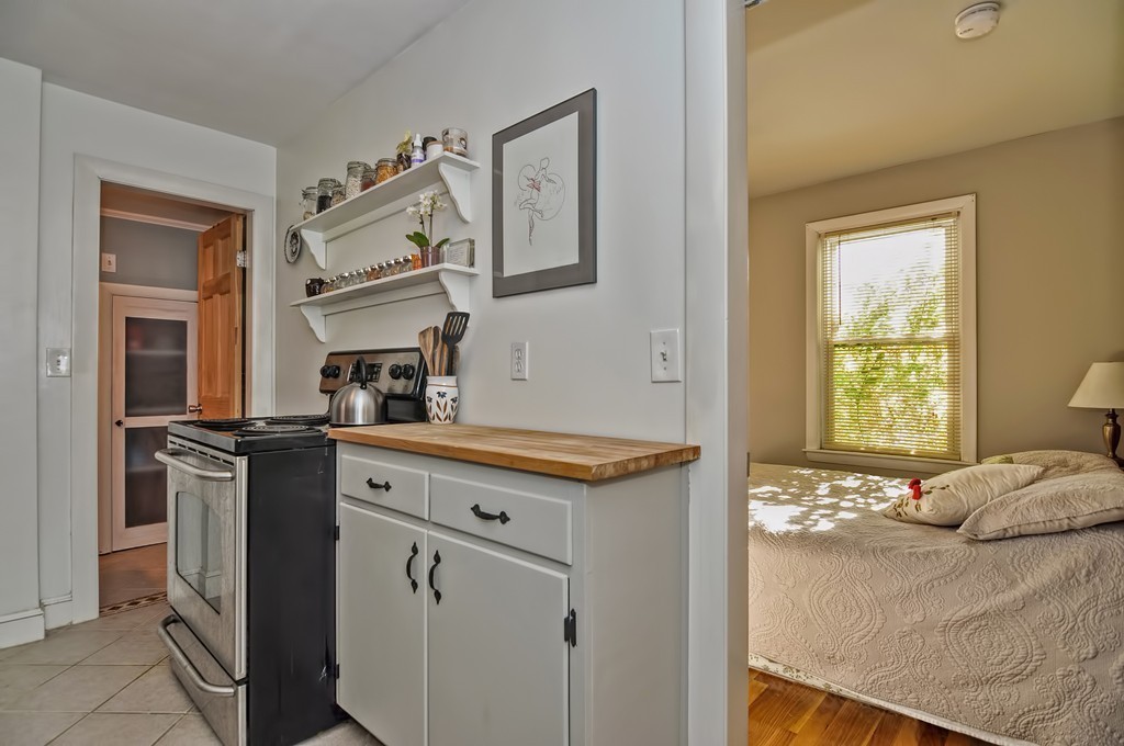 54 Main Street, Unit A Foxboro, MA 02035 - Photo 5 of 21 a kitchen with a stove and a refrigerator