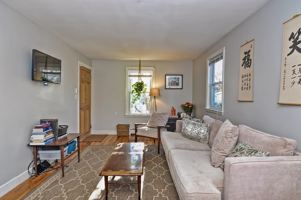 54 Main Street, Unit A Foxboro, MA 02035 - Photo 7 of 21 a living room with furniture and a window