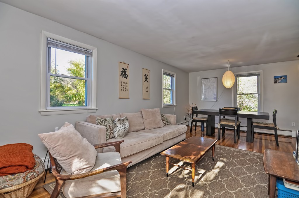 54 Main Street, Unit A Foxboro, MA 02035 - Photo 8 of 21 a living room with furniture and a window