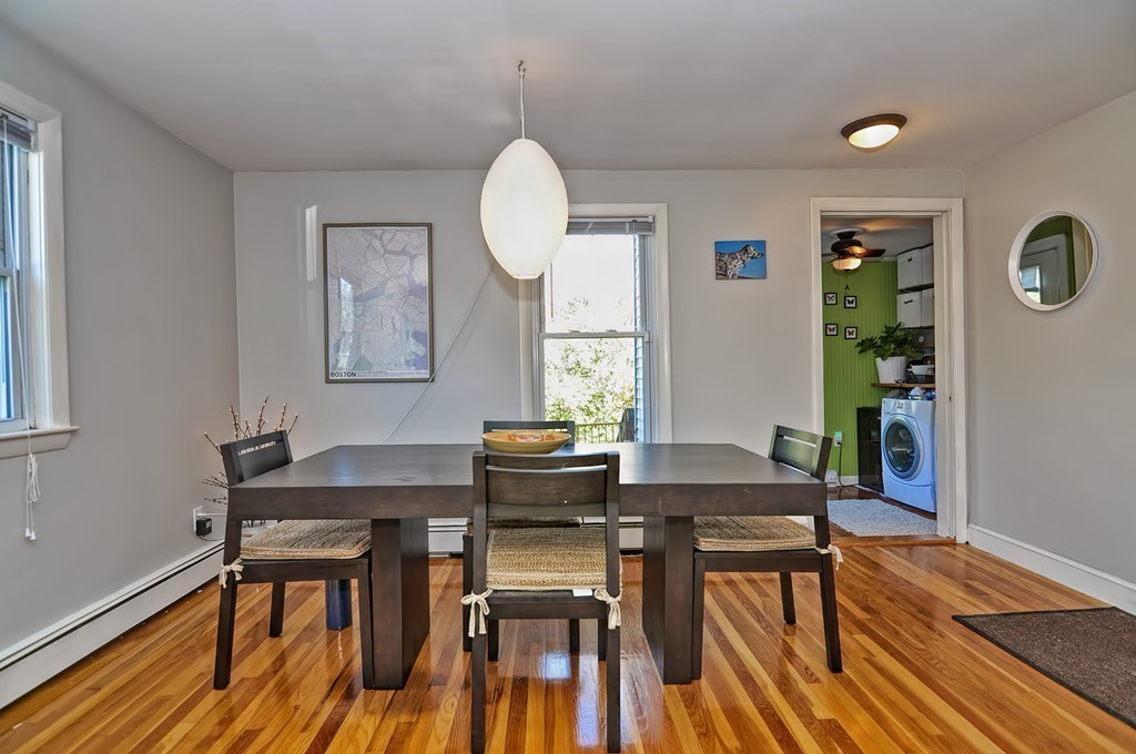 54 Main Street, Unit A Foxboro, MA 02035 - Photo 9 of 21 a view of a dining room with furniture and wooden floor