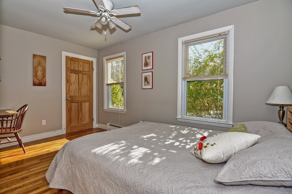 54 Main Street, Unit A Foxboro, MA 02035 - Photo 10 of 21 a bedroom with a bed and window