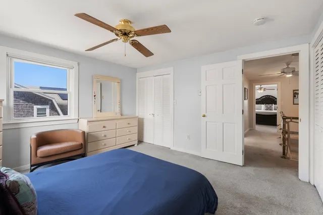 a bedroom with furniture and a window