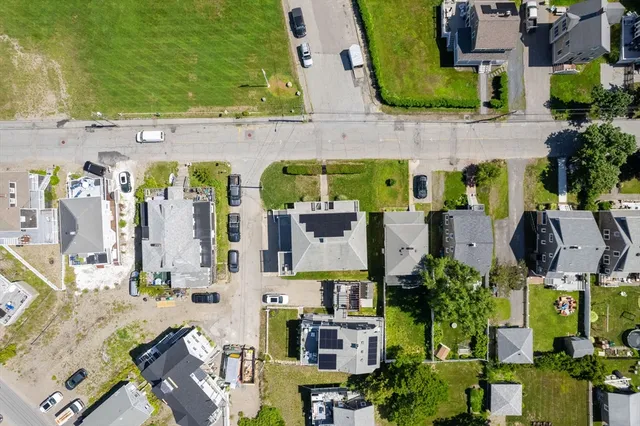 an aerial view of houses with outdoor space