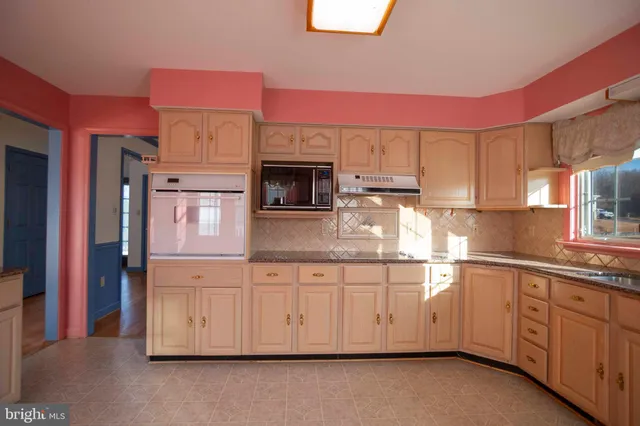 a view of a deck with a wooden fence